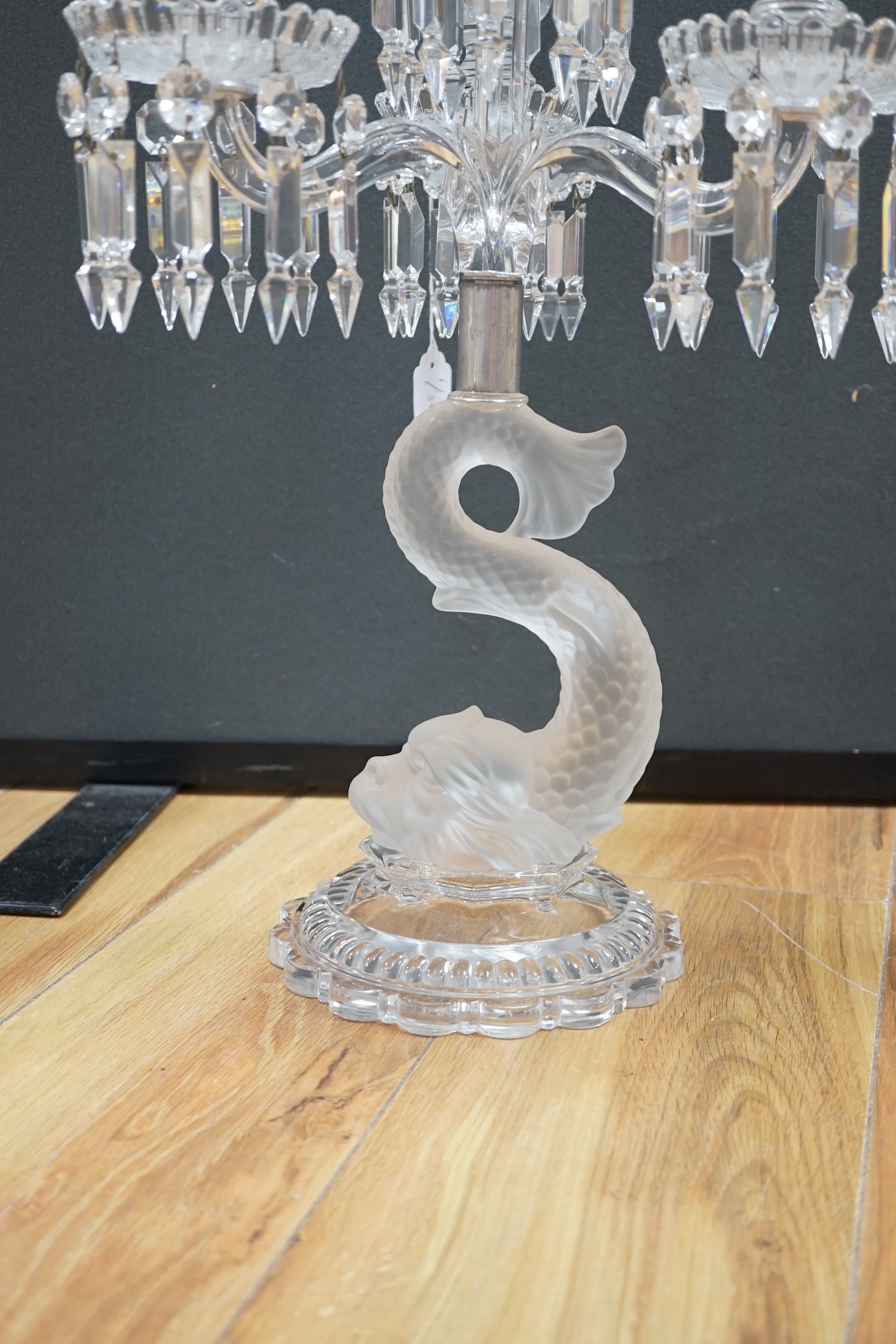 A Baccarat three branch, fish stemmed glass candelabra, 68cm high